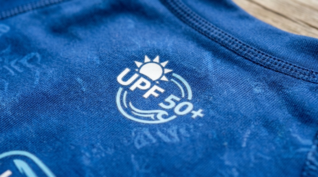 Close-up of rash guard fabric showing sun protection design
